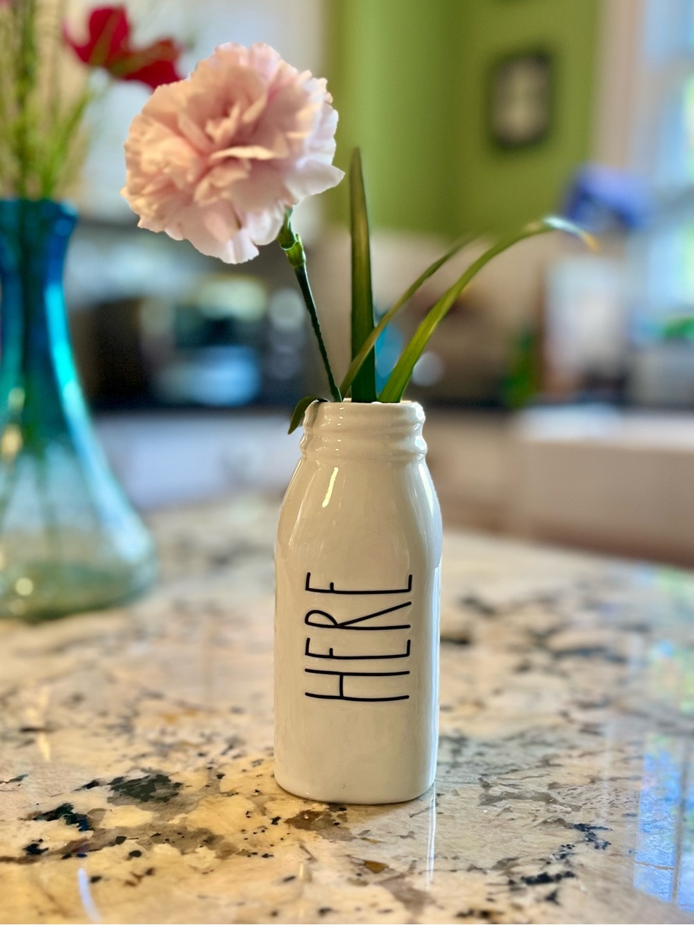 Rae Dunn White Ceramic 'HERE' Milk Bottle Bud Vase in like new condition